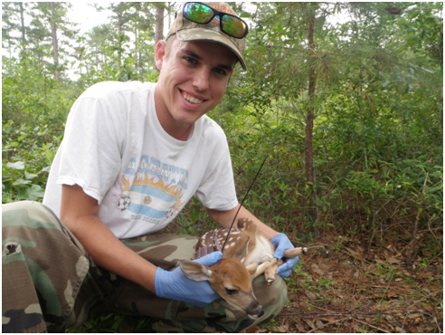Alex Vail with a new born fawn