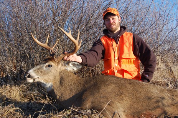 Hunter with a nice whitetail buck