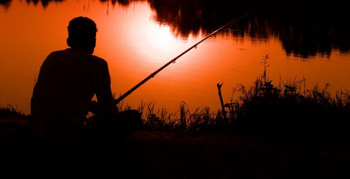 Fishing as the sun sets