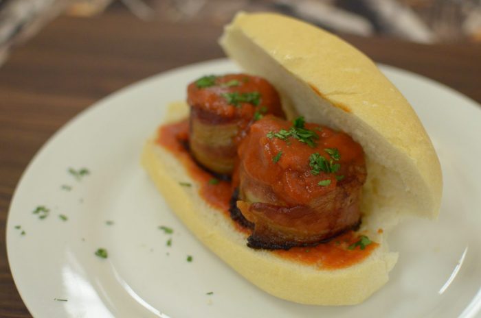 Bacon wrapped venison meatball sub stuffed with cheese