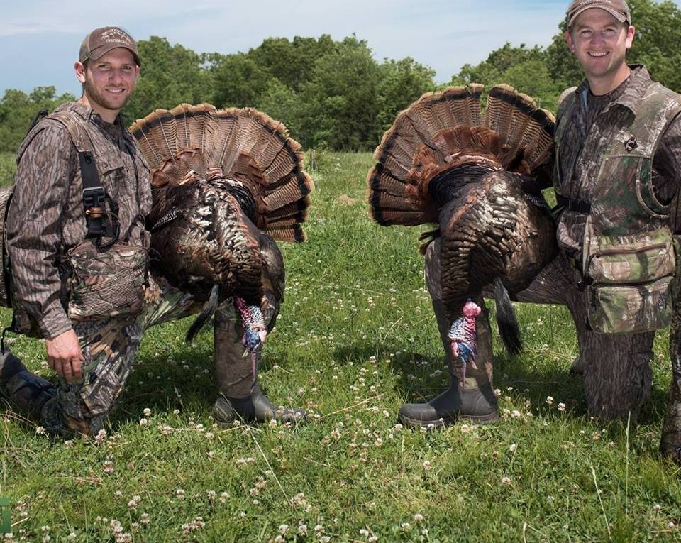 Two turkey hunters with their big turkeys they shot