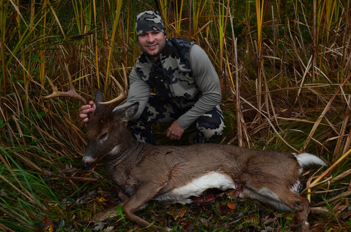 Wisconsin deer hunter with a big buck on public land