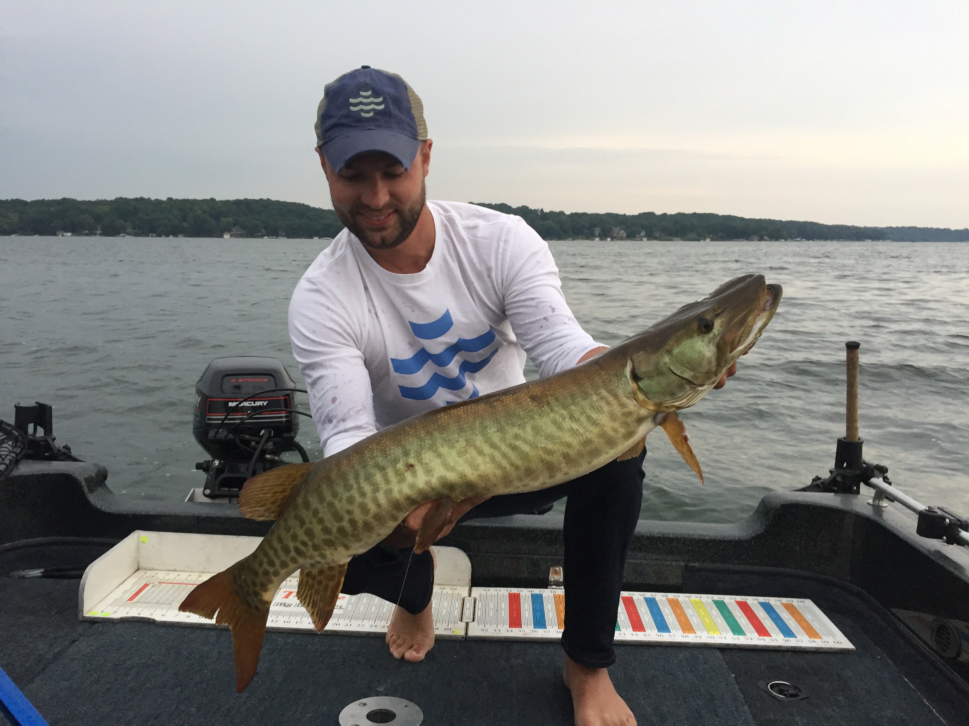 fisherman holds a big musky from Wisconsin